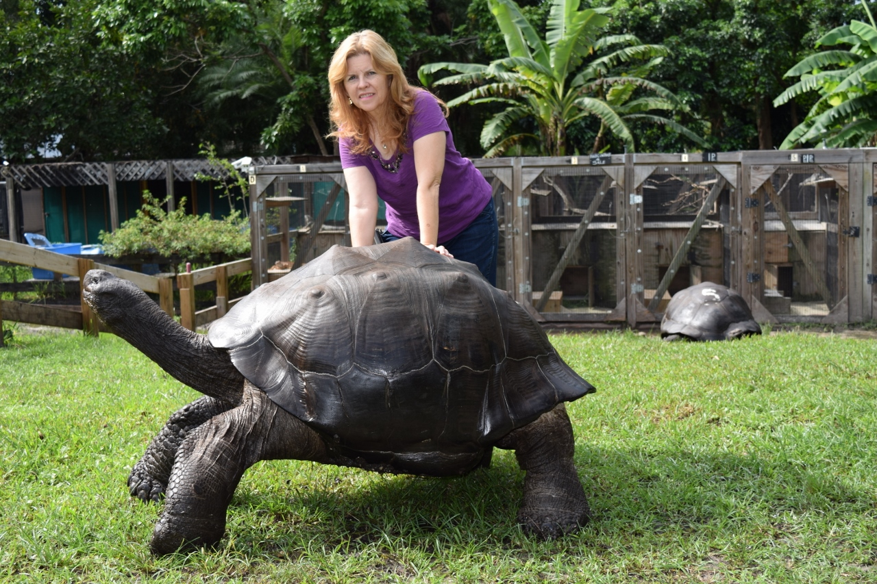 Laura-and-Bernie-standing-next-to-Galapagoes.jpg